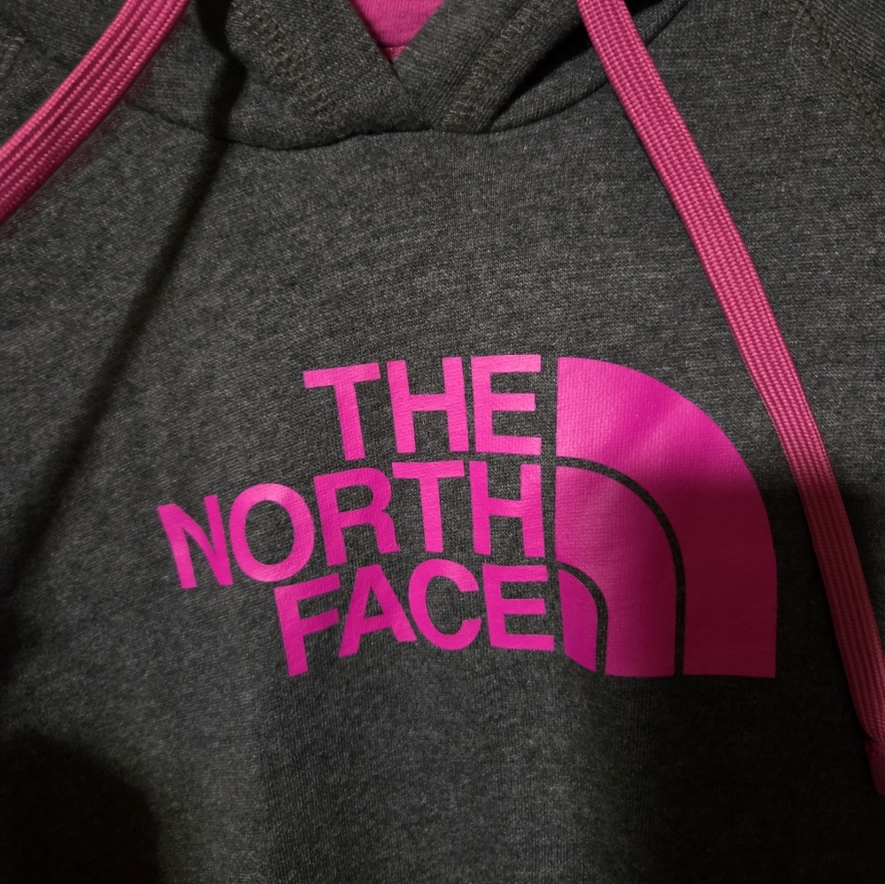 The North Face Charcoal Hoodie with Vibrant Pink Accents